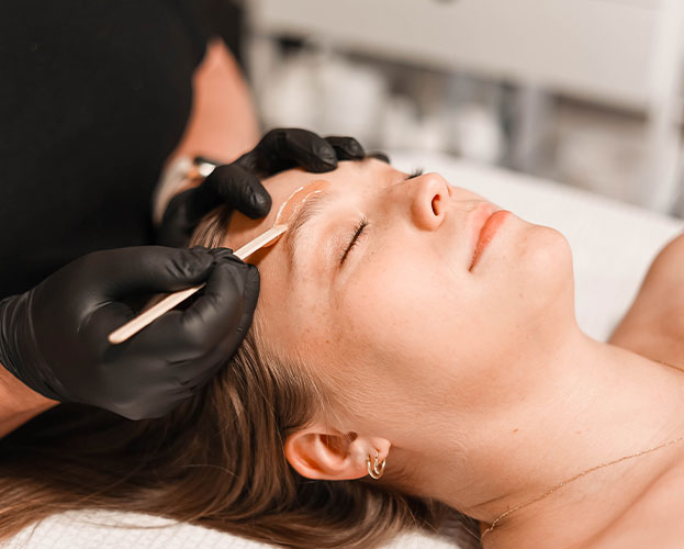 a woman lying down and looking at the camera