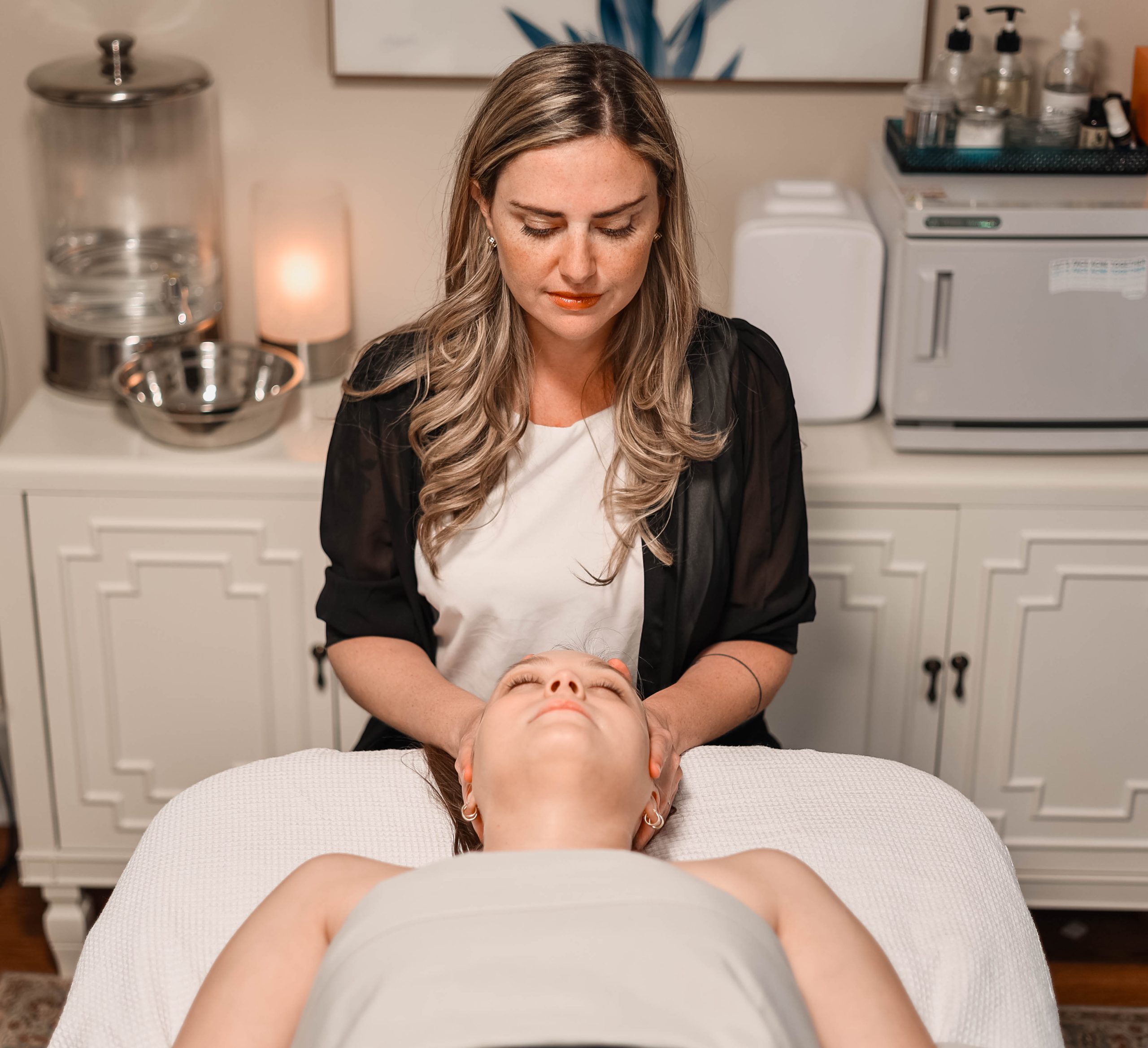 a woman sitting on a bed